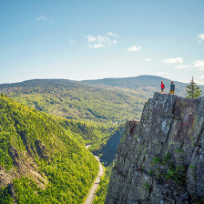 Hikers take in panoramic views atop Table Rock near Colebrook, New Hampshire