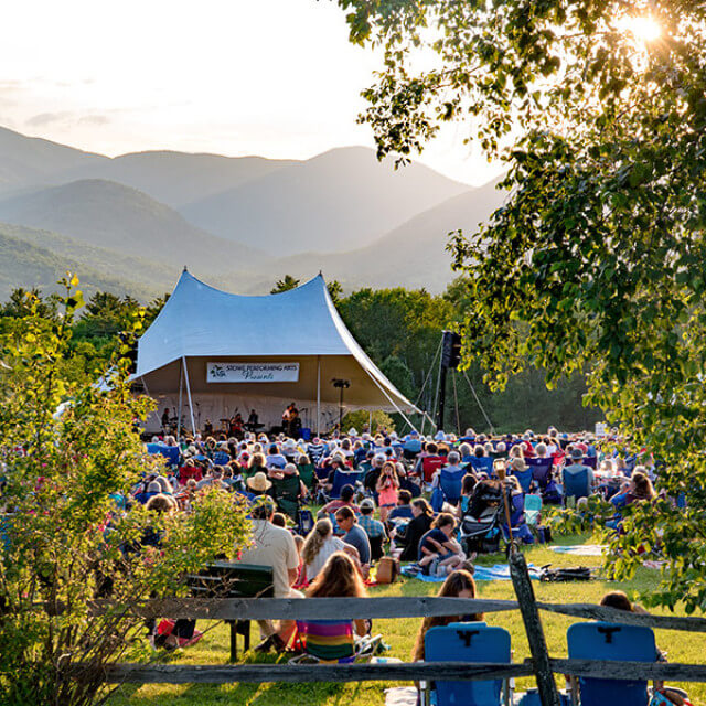 Attending an outdoor performing arts event in Stowe, Vermont
