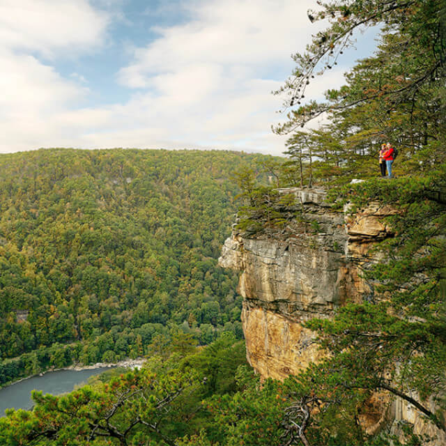 Hikers take in the view atop West Virginia's Endless Wall Trail