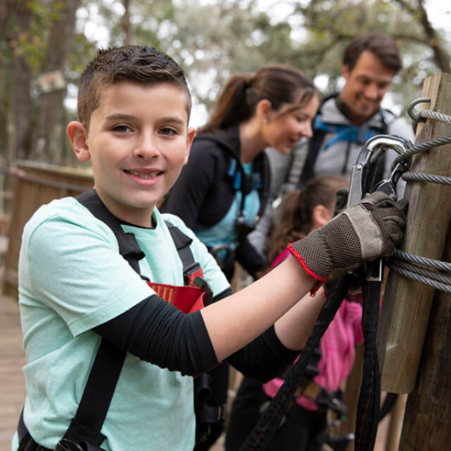 A treetop obstacle course at Treehoppers Aerial Adventure Park in Dade City, Florida