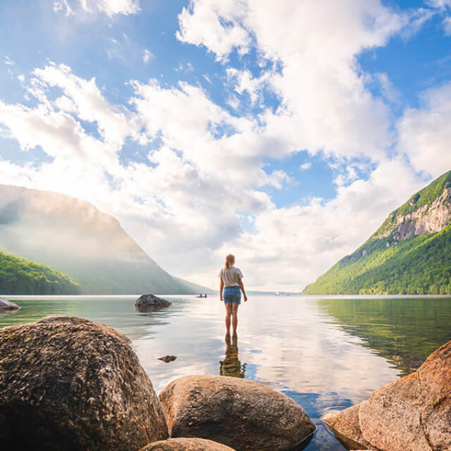 Standing in water surrounded by Vermont mountains