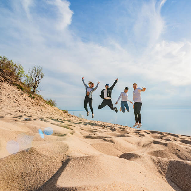 Enjoying the sand of Sleeping Bear Dunes National Lakeshore in Traverse City, Michigan 