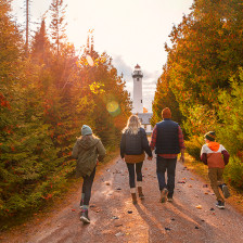 Fall colors line a path to Michigan's Presque Isle Lighthouse