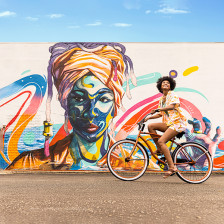 Biking past a colorful mural in St. Petersburg, Florida