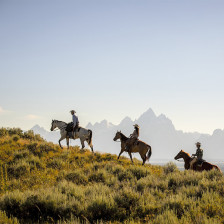 Horseback riding through mountain landscapes in Wyoming