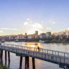 Biking at sunset with the Portland, Oregon, skyline in the background