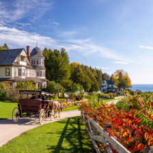 Enjoying a horse-drawn carriage ride along East Bluff on Mackinac Island, Michigan